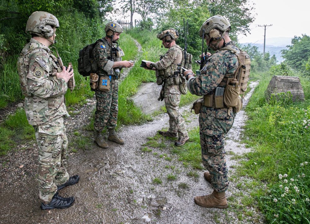 Members of the Armed Forces of Bosnia and Herzegovina’s Joint Terminal Attack Controller (JTAC) team train with US Special Operations Forces to coordinate a training bomber support mission near Tuzla, Bosnia and Herzegovina, 30 MAY 2023.