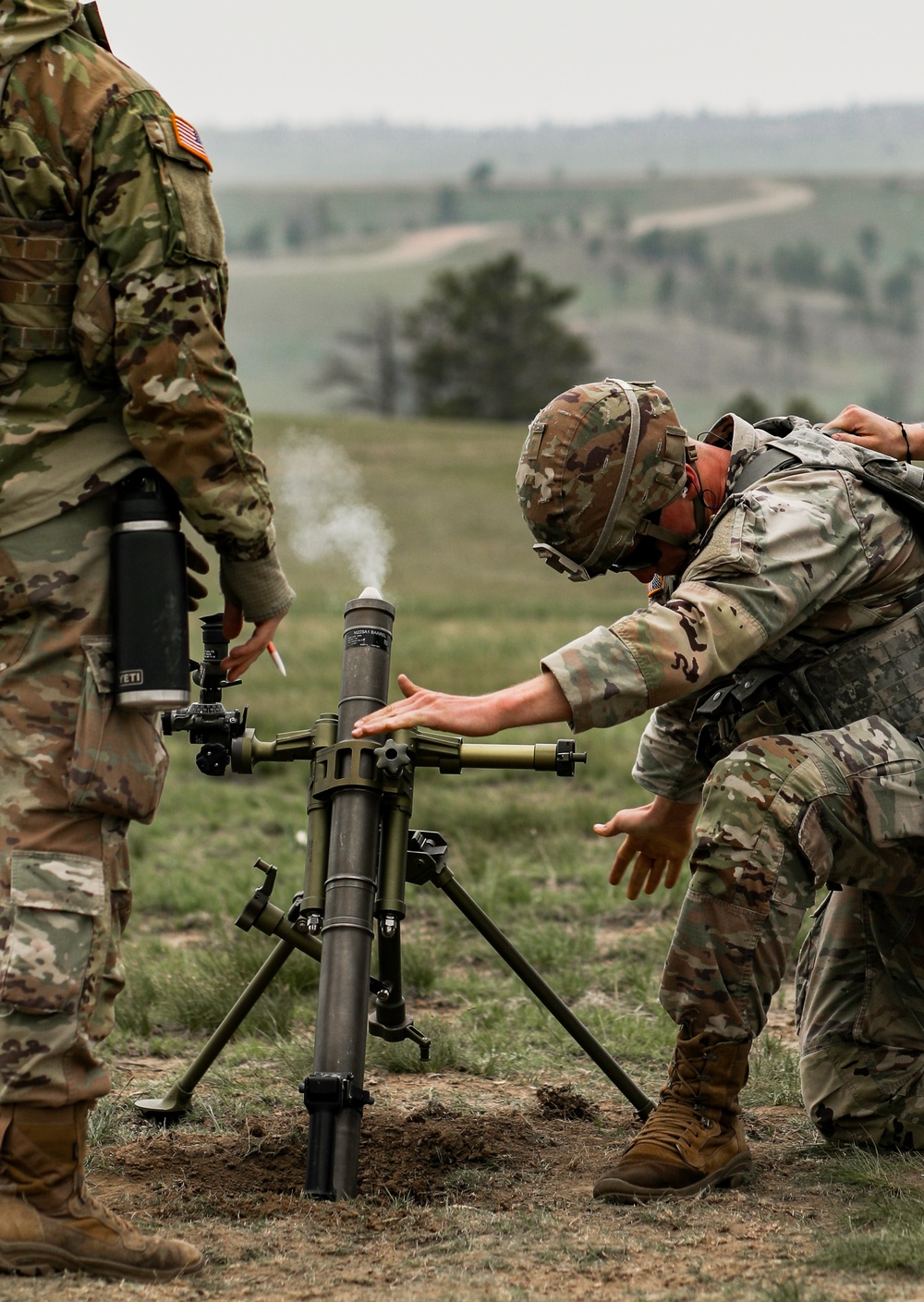 Iowa infantryman prepares to fire 60 mm mortar