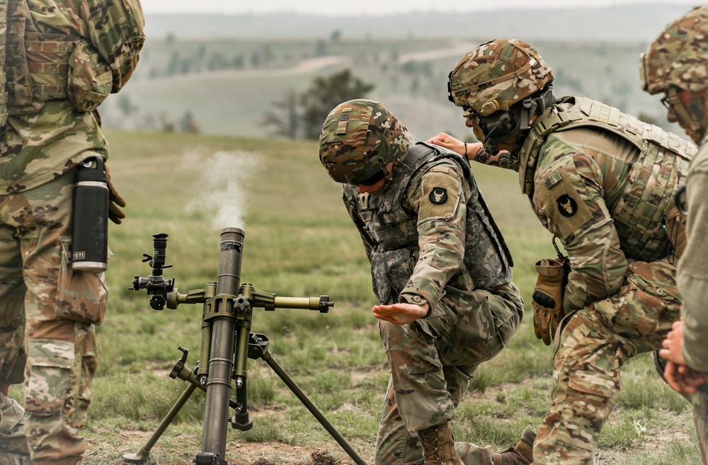 Iowa infantrymen fire 60 mm mortar