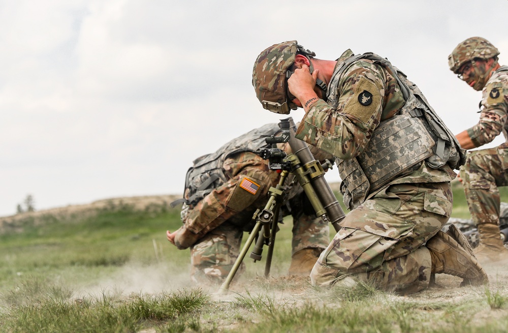 Iowa infantrymen fire 60 mm mortar