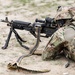 Iowa infantryman prepares to fire M240 machine gun