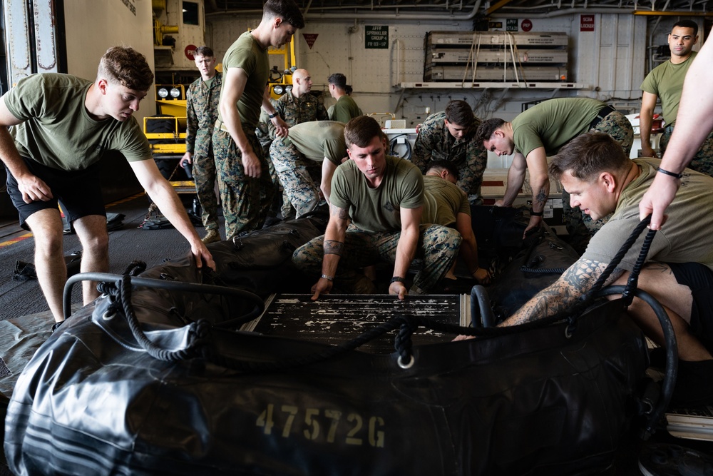 Marines assemble rafts on USS Bataan