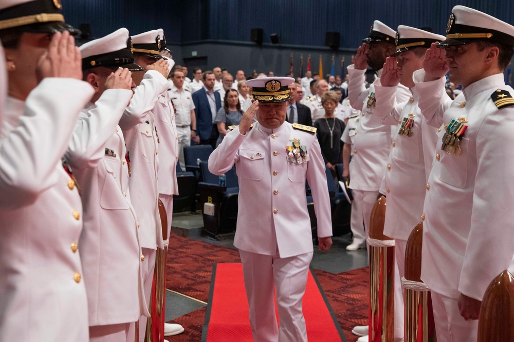 Vice Adm. Tawara Tateki, commander, Fleet Submarine Force, JMSDF salutes side boys during the Commander, Submarine Group 7 change of command ceremony.