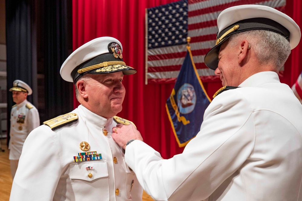 Vice Adm. Karl Thomas, commander, U.S. 7th Fleet presents the Legion of Merit to Rear Adm. Rick Seif.