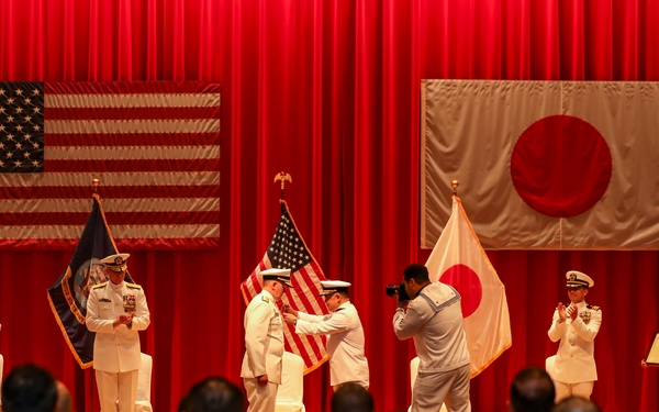 Vice Adm. Tawara Tateki, commander, Fleet Submarine Force, JMSDF , right, presents a 1st Grade Defense Cooperation Medal to Rear Adm. Rick Seif