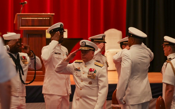 Rear Adm. Rick Seif salutes side boys during the Commander, Submarine Group 7 change of command ceremony.