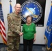 Richardson presents coin to AFMC’s longest-serving civilian