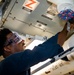 USS Robert Smalls (CG 62) Sailor Conducts Maintenance