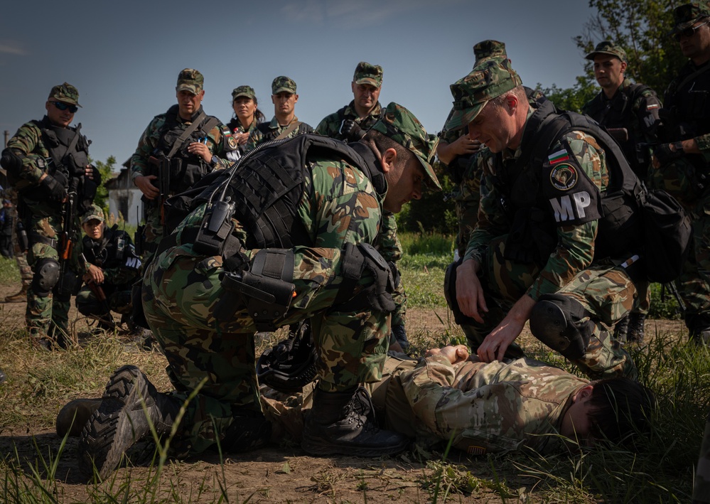 Soldiers from the 508th Military Police Company demonstrate detaining procedures to Albanian and Bulgarian servicemen during DEFENDER 23