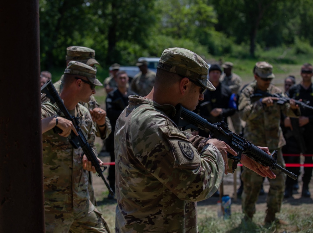 Soldiers assigned to the 508 Military Police Company display room clearing maneuvers to Albanian military police during DEFENDER 23