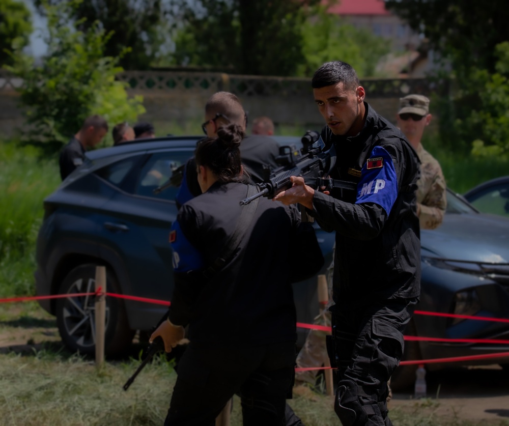 Soldiers assigned to the 508 Military Police Company display room clearing maneuvers to Albanian military police during DEFENDER 23