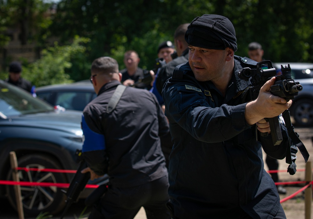 Soldiers assigned to the 508 Military Police Company display room clearing maneuvers to Albanian military police during DEFENDER 23