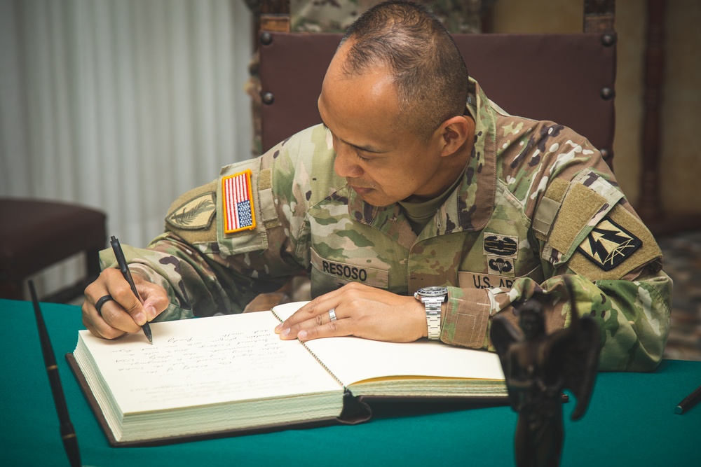 Brig. Gen. Royce Resoso signs Brig. Gen. Davide Pilatti's guestbook