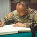Brig. Gen. Royce Resoso signs Brig. Gen. Davide Pilatti's guestbook