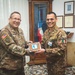 Ten. Col. Daniele Angelo Grasso exchanging gifts with Col. Brian Wisniewski