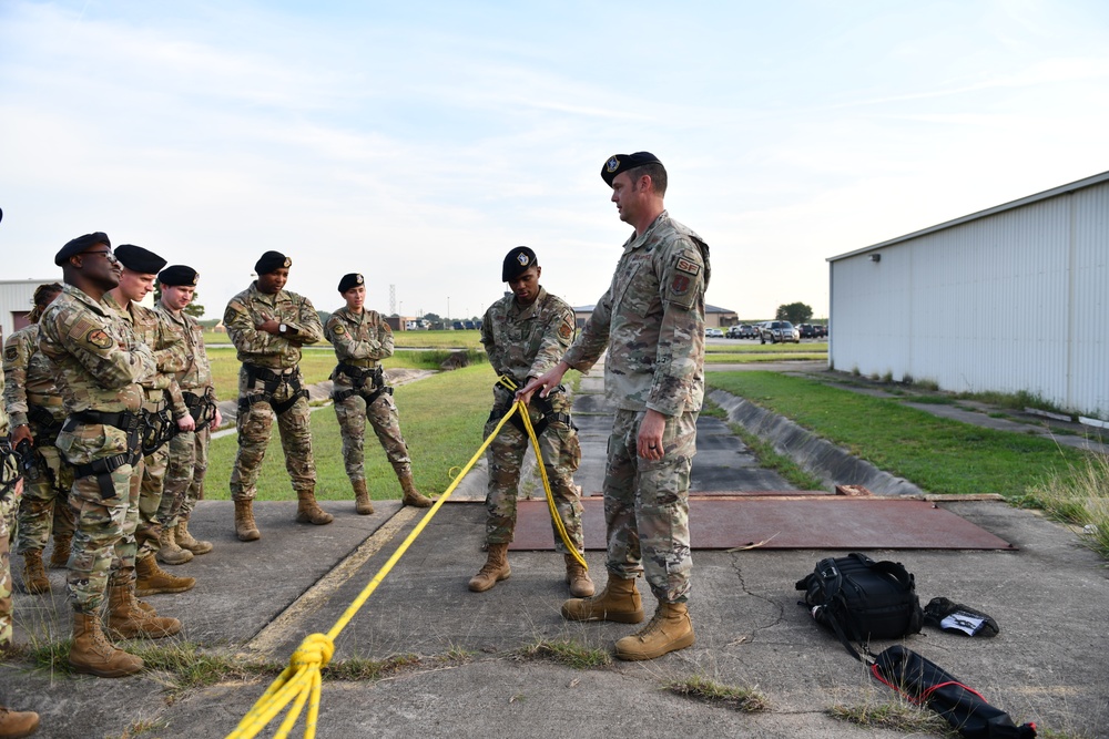 Defenders of the 147th Attack Wing practice rappelling