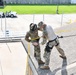 Defenders of the 147th Attack Wing practice rappelling