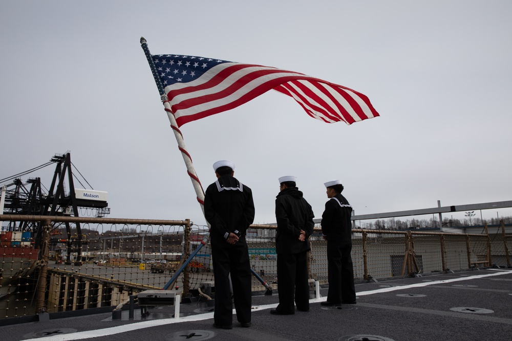 USS Harpers Ferry (LSD 49) sailors stand by to shift colors