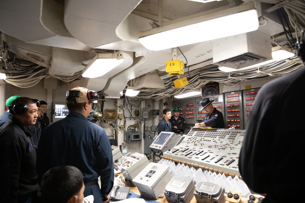 USS Harpers Ferry (LSD 49) sailors participate in a main space fire drill