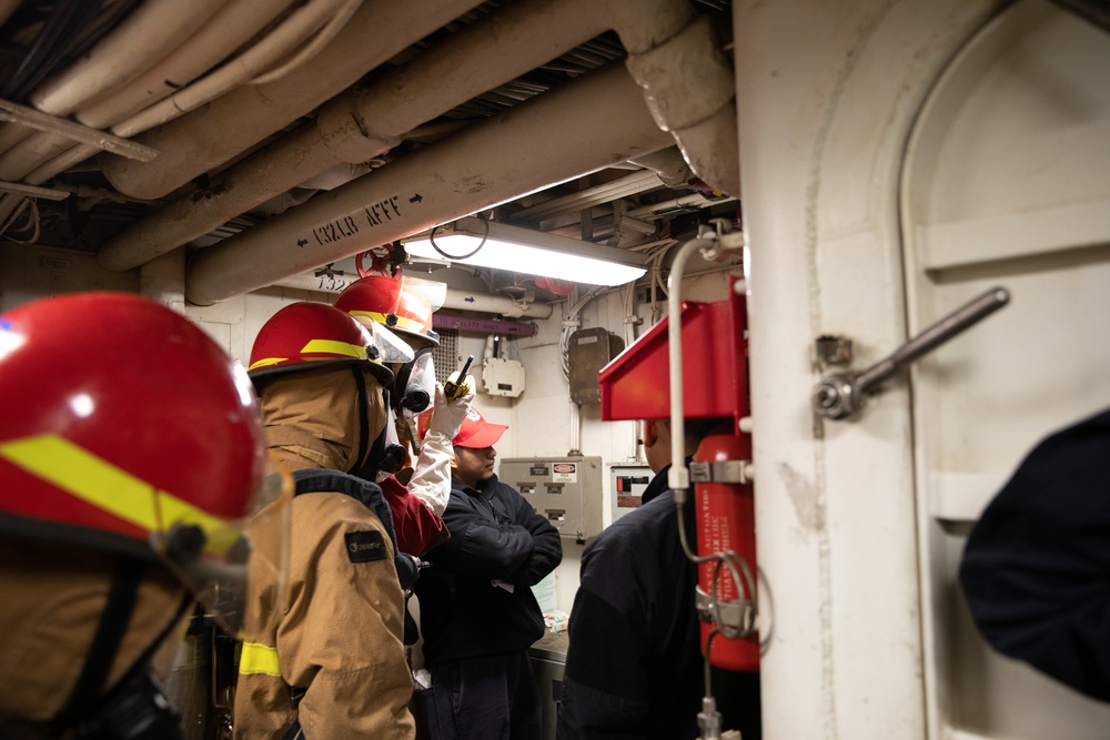 USS Harpers Ferry (LSD 49) sailors participate in a main space fire drill