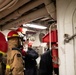 USS Harpers Ferry (LSD 49) sailors participate in a main space fire drill