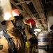 USS Harpers Ferry (LSD 49) sailors participate in a main space fire drill