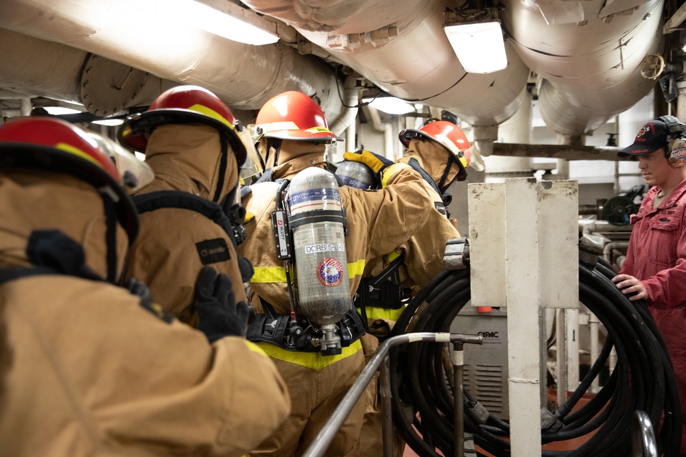 USS Harpers Ferry (LSD 49) sailors participate in a main space fire drill