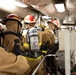 USS Harpers Ferry (LSD 49) sailors participate in a main space fire drill