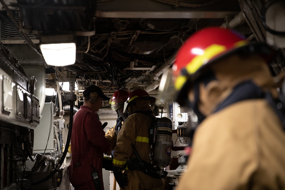 USS Harpers Ferry (LSD 49) sailors participate in a main space fire drill