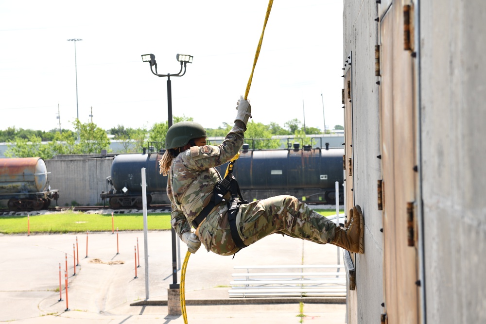 Defenders of the 147th Attack Wing practice rappelling