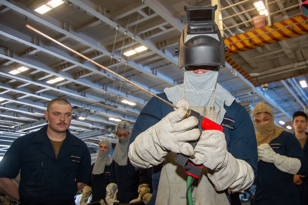 USS Ronald Reagan (CVN 76) Sailors train on firefighting