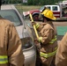 110th Wing firefighters remove glass from vehicle