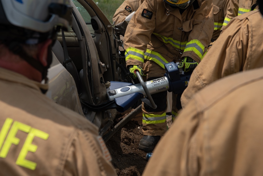 110th Wing fire fighters use a test vehicle to practice new tools