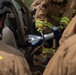 110th Wing fire fighters use a test vehicle to practice new tools