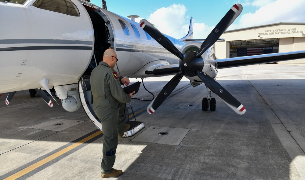 147th Attwack Wing pillot conducts preflight inspection