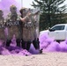 Security Forces Airmen walk through smoke