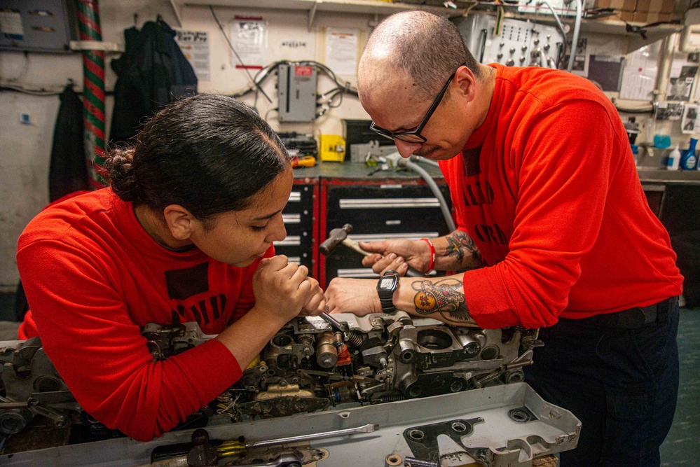 Sailors Disassemble a Bomb Rack