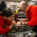 Sailors Disassemble a Bomb Rack