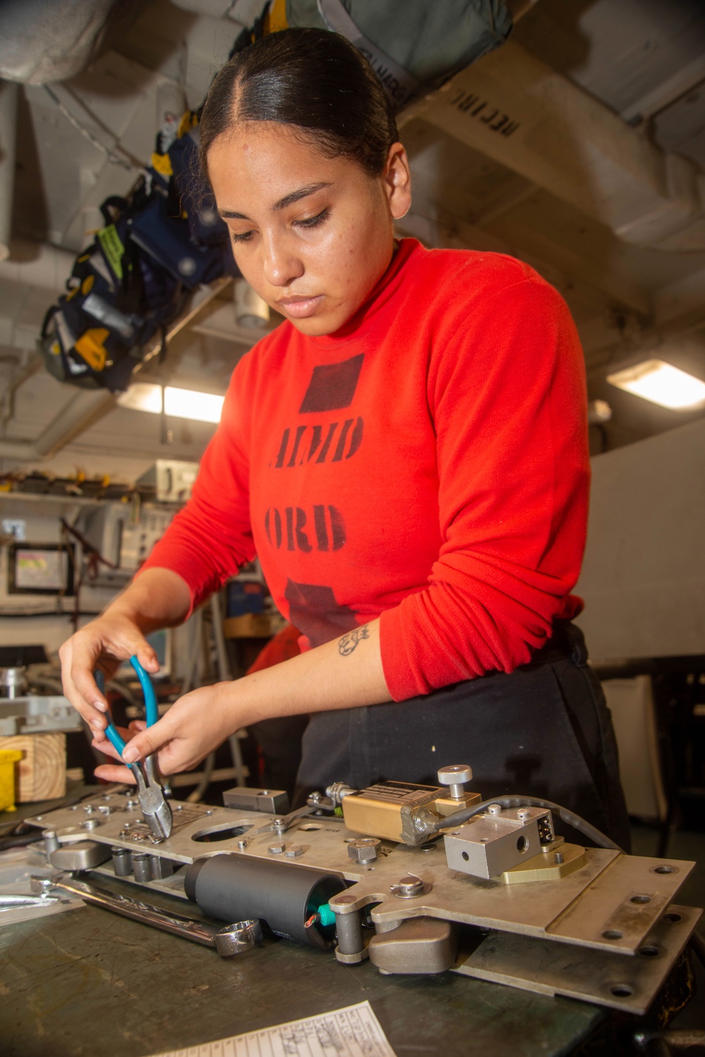 Sailor Disassembles Bomb Rack