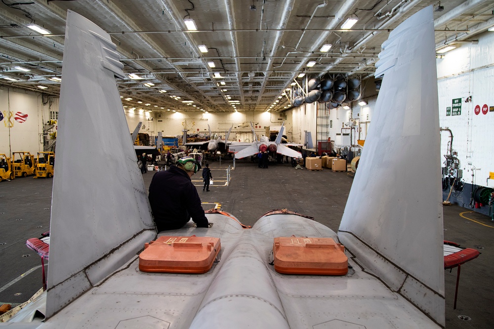 Sailors Conduct Aircraft Maintenance in USS Gerald R. Ford’s Hangar Bay