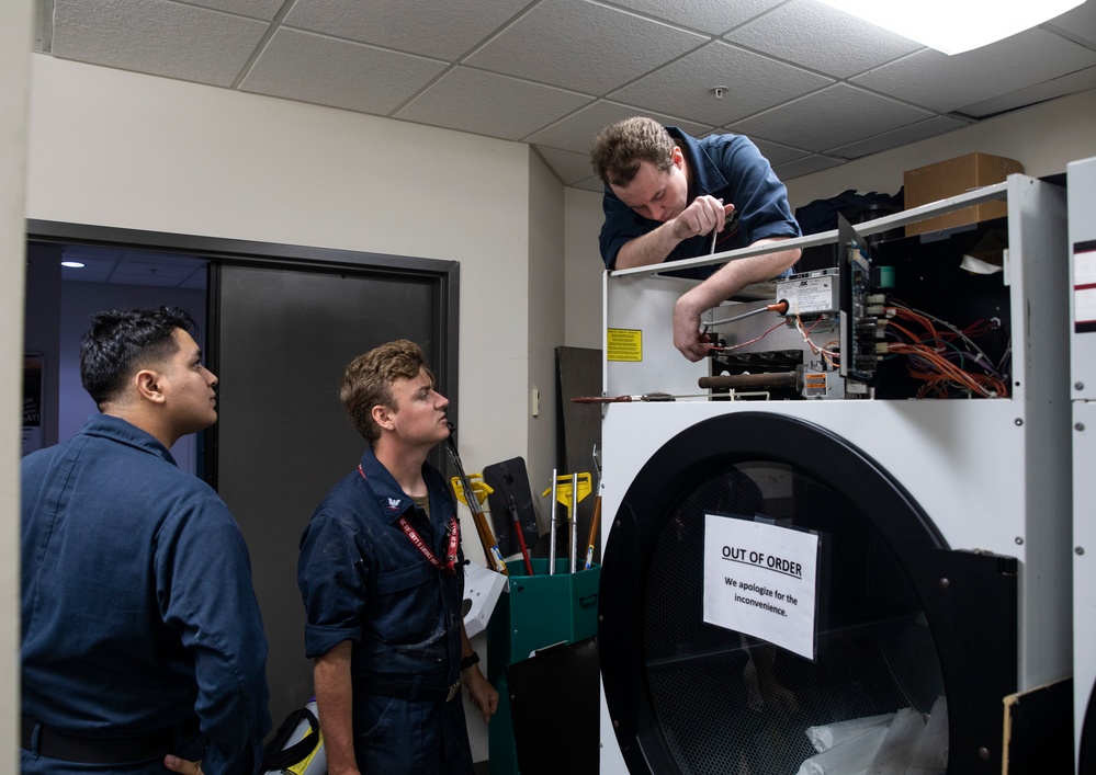 ESL Sailors TroubleShoot Charles King Fitness Center's Laundry Facilities