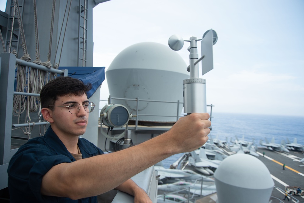 USS Ronald Reagan (CVN 76) Aerographer’s Mate hold training on meteorological.