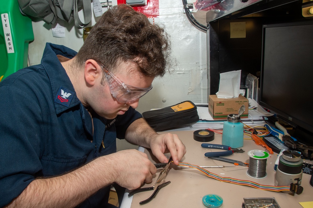 USS Ronald Reagan (CVN 76) Sailors repair components