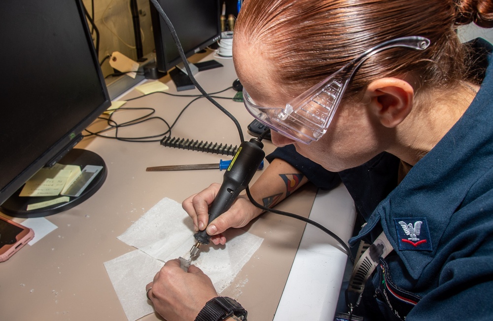 USS Ronald Reagan (CVN 76) Sailors repair components