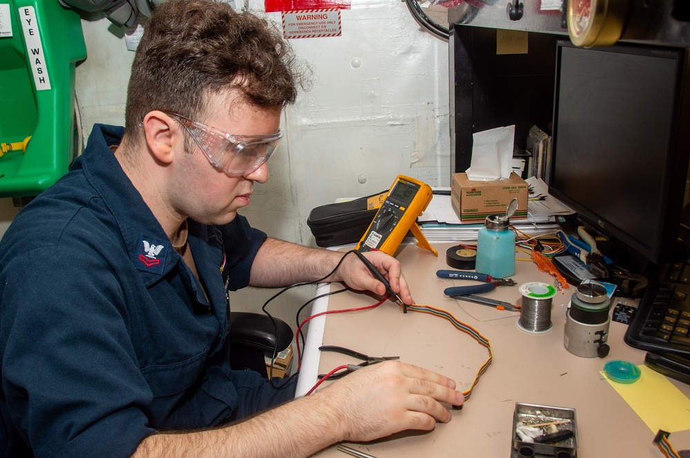 USS Ronald Reagan (CVN 76) Sailors repair components