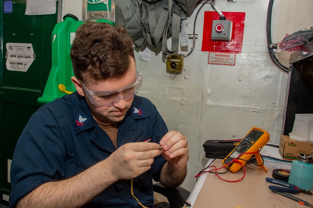 USS Ronald Reagan (CVN 76) Sailors repair components