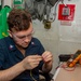 USS Ronald Reagan (CVN 76) Sailors repair components