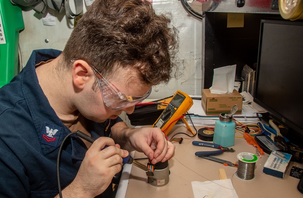 USS Ronald Reagan (CVN 76) Sailors repair components