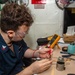 USS Ronald Reagan (CVN 76) Sailors repair components