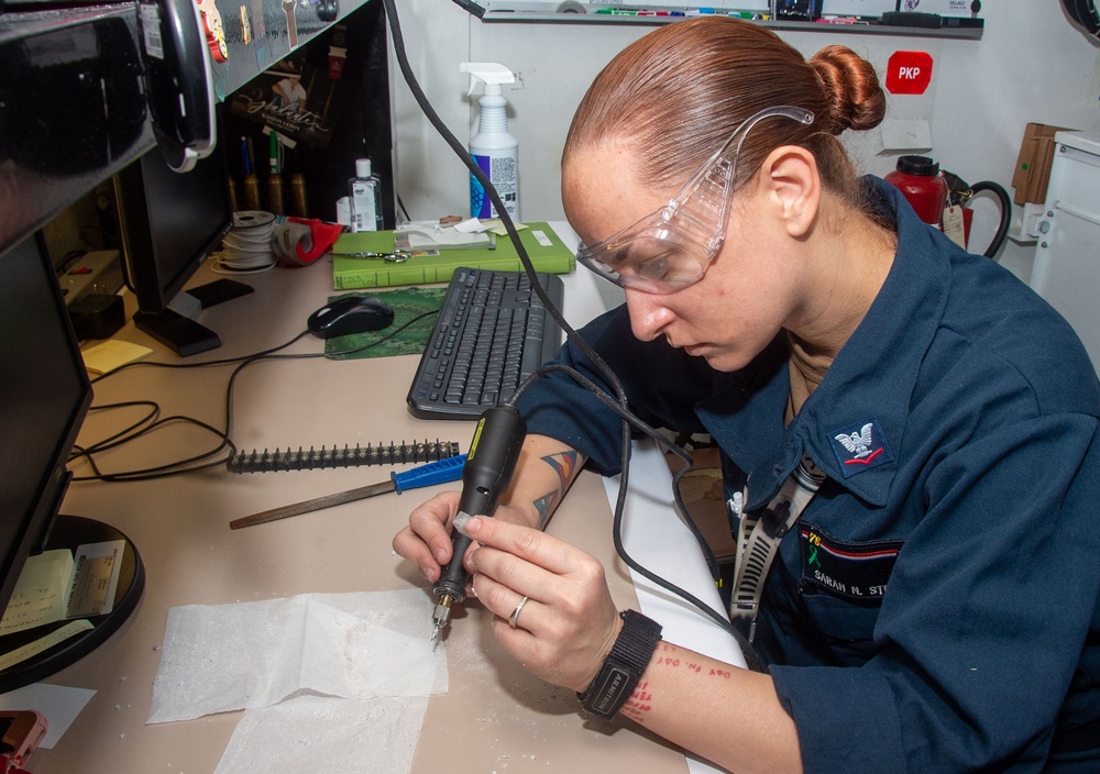 USS Ronald Reagan (CVN 76) Sailors repair components